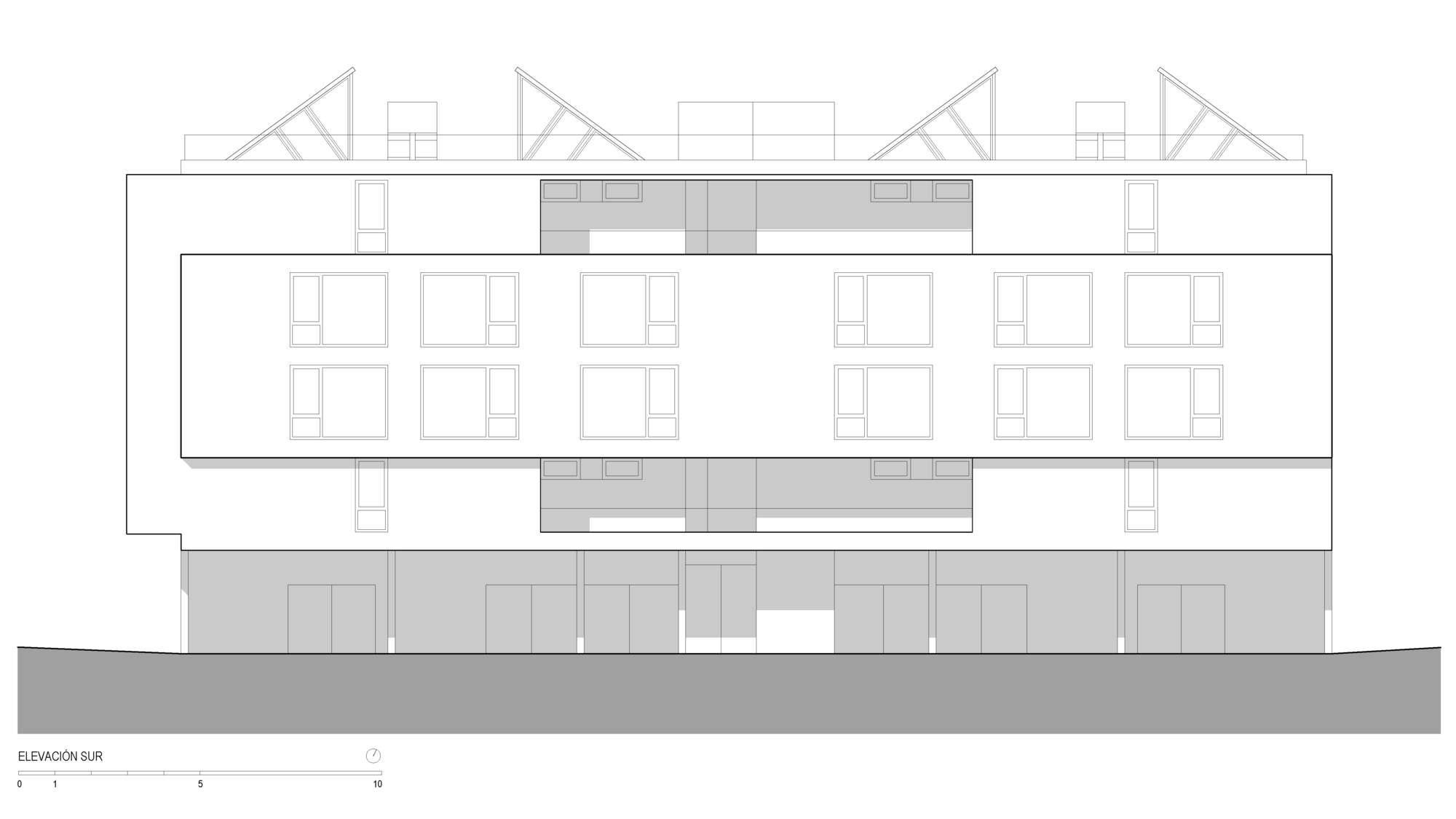 South elevation drawing with a long projecting band of paired windows above a ground floor of shaded doorways and angled roof skylights