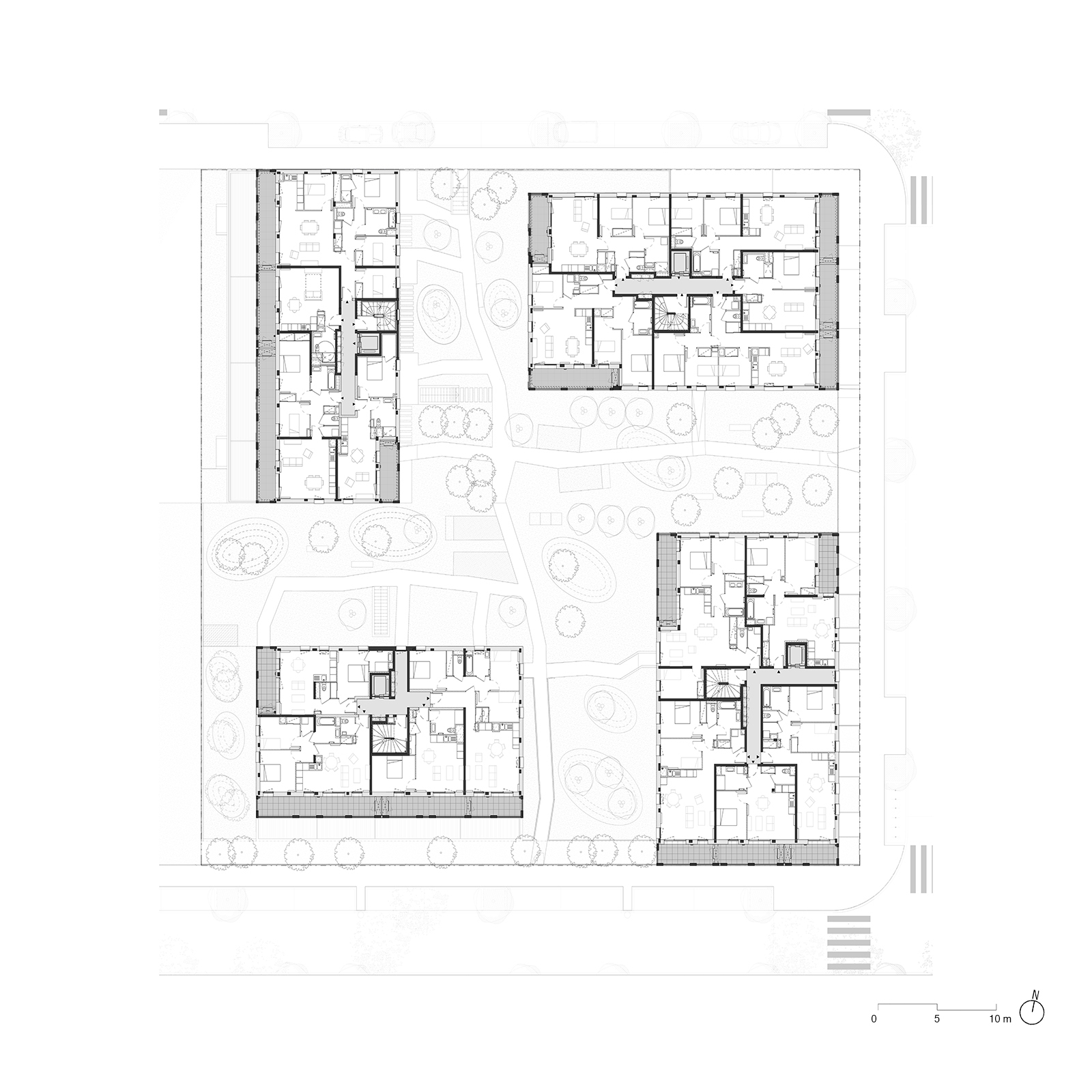 Upper floor plan drawing showing apartment layouts in four separate blocks, each with a central stair core, arranged around garden paths