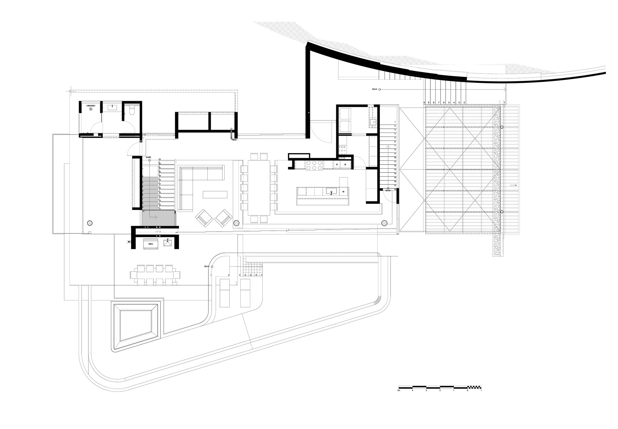 Plan drawing of the main living level with dining table, kitchen island, stair, pool terrace and a curved retaining wall along the top edge