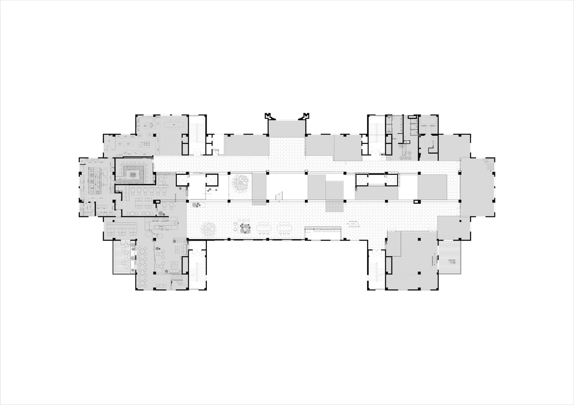 Floor plan drawing of the lowest level showing a long central corridor flanked by rooms and projecting wings at both ends