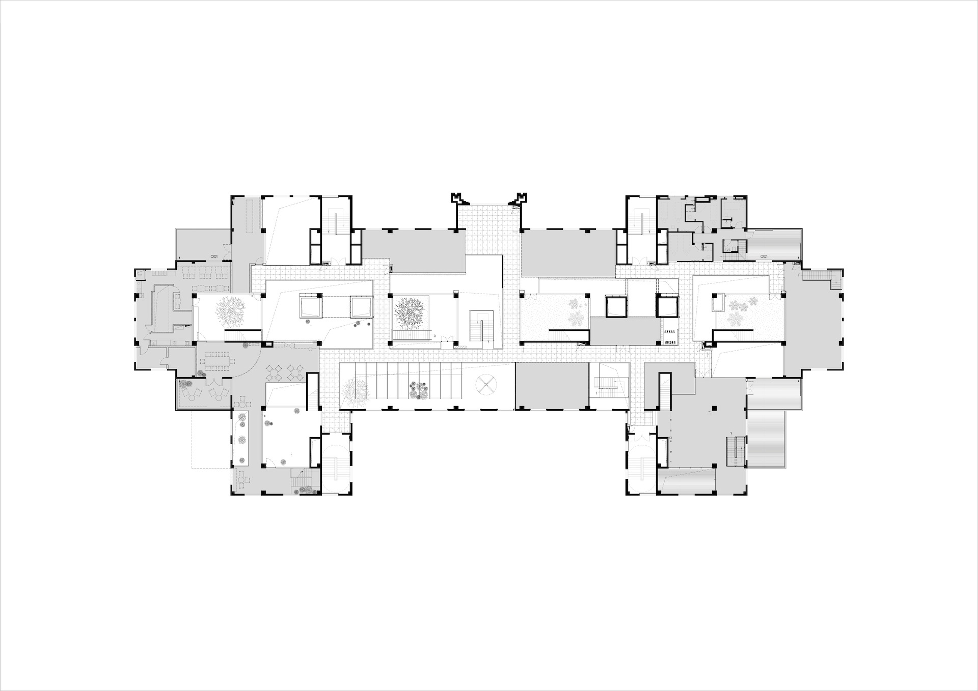 Floor plan drawing of the middle level showing small courtyards, stairs and planted voids arranged along a central spine
