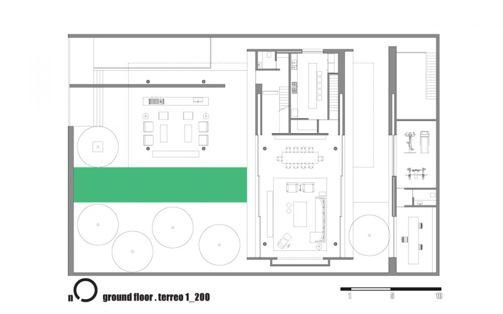 Ground floor plan drawing showing a central block of living and dining rooms, a green pool strip, circular tree marks and a gym wing