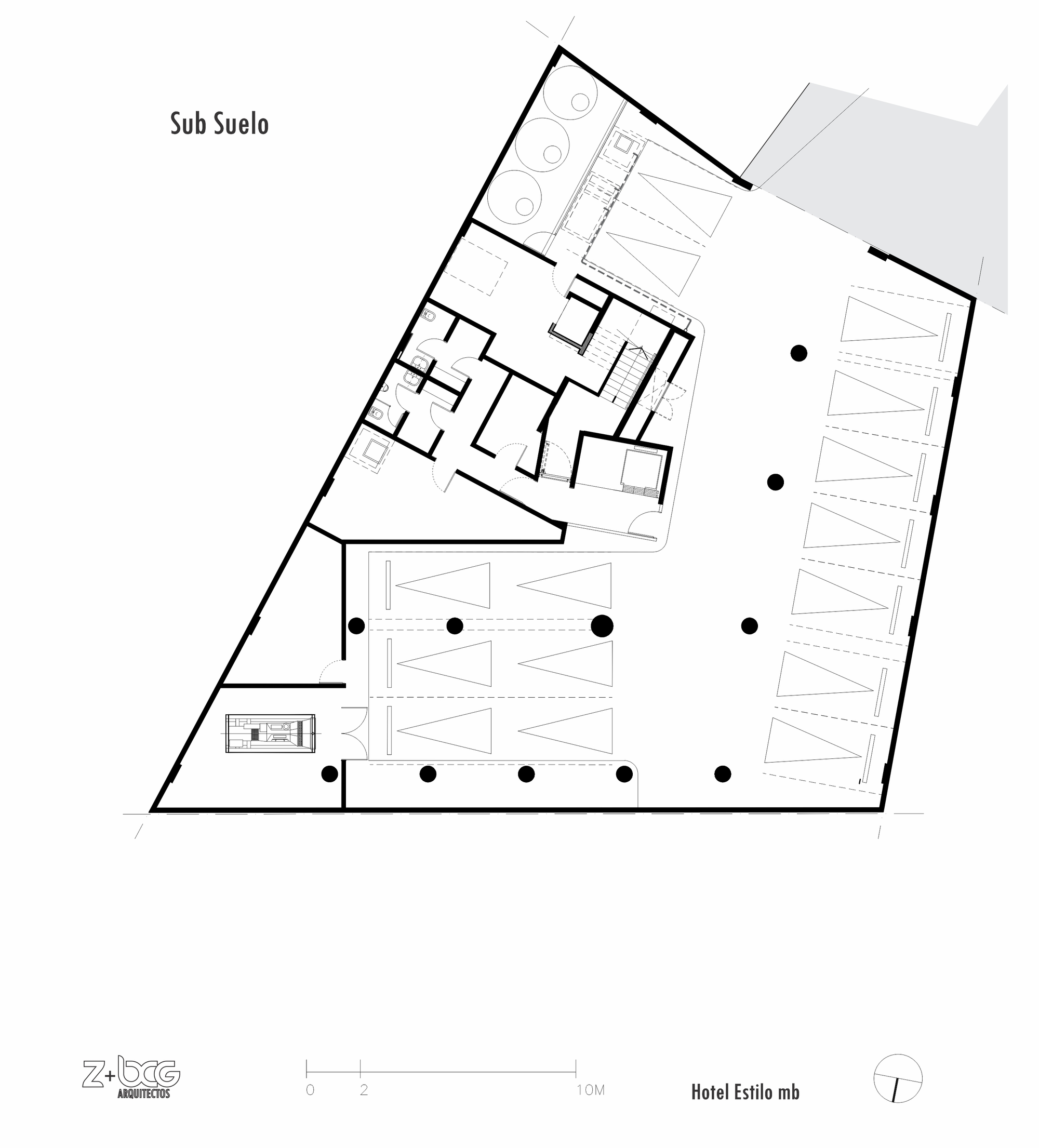 Basement floor plan drawing of a wedge-shaped site showing parking bays, structural columns, stairs and service rooms