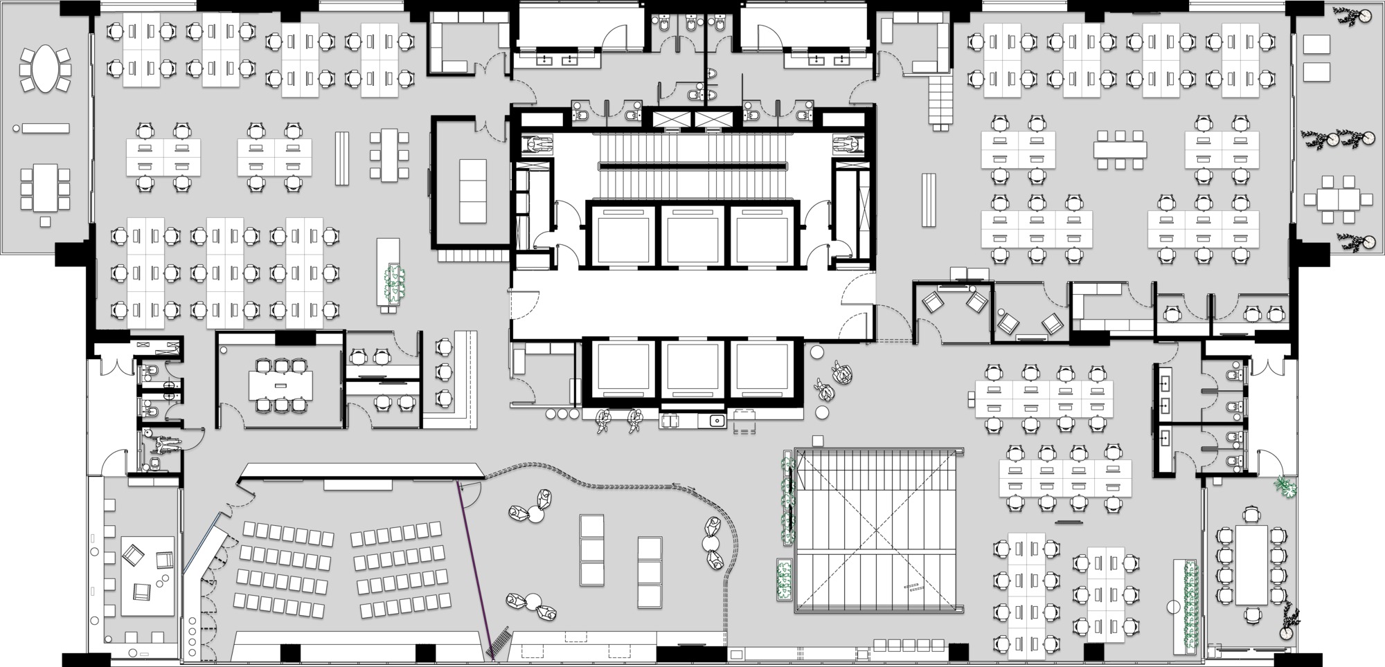Floor plan drawing with a tiered seating area, a rooftop-style void and desk groups around the central service core