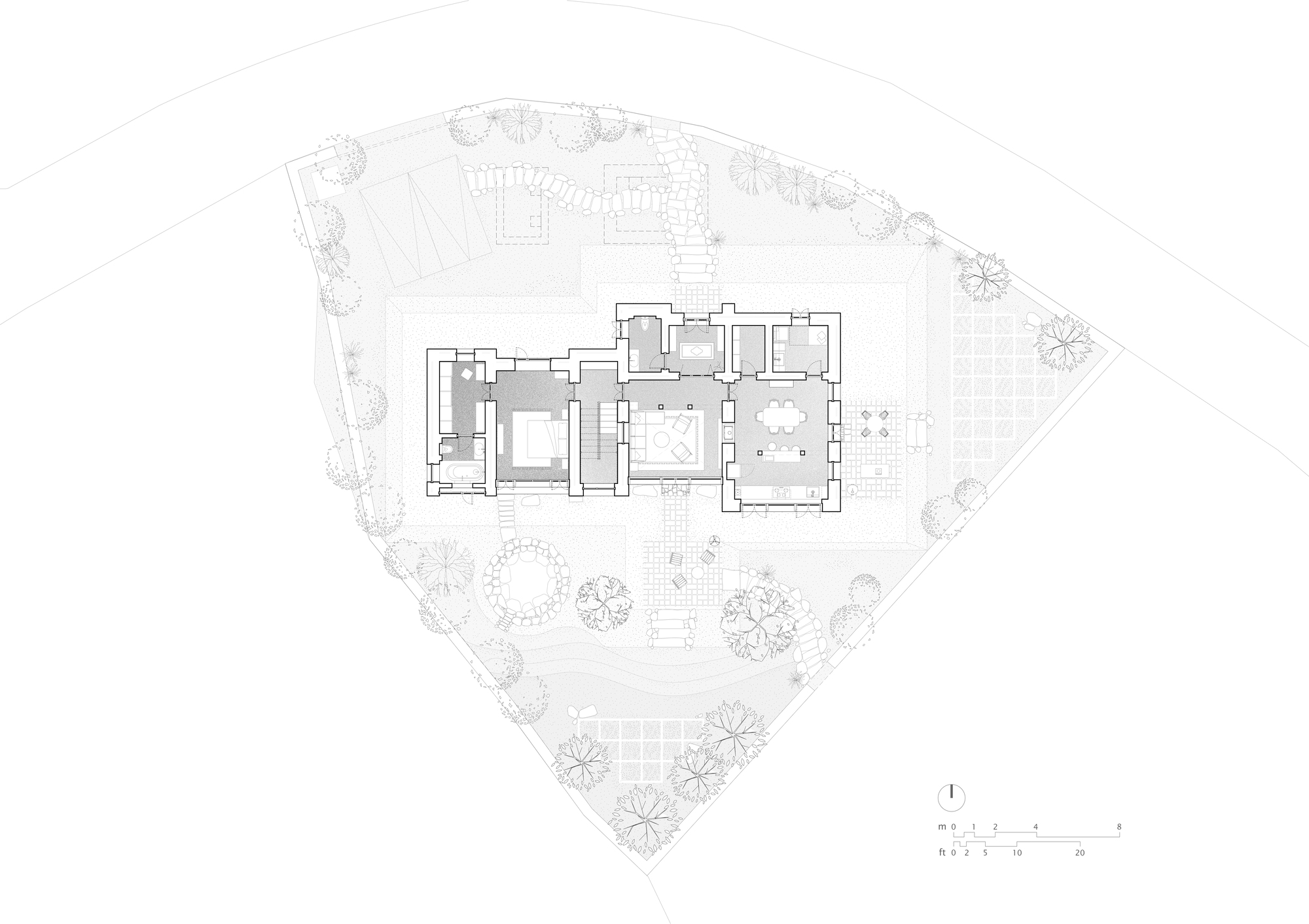 Ground floor plan drawing of an elongated house with thick walls, a central courtyard room and terraces set in a wedge-shaped garden