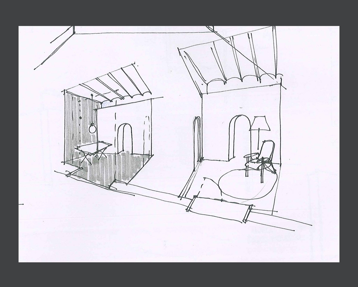 Ink perspective sketch of two small alcoves with arched niches, a folding table, a lamp and an armchair on a round rug