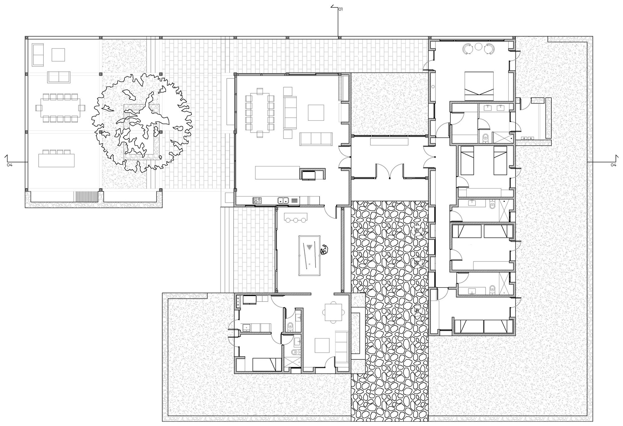 Floor plan drawing showing a courtyard house with a tree-filled terrace, central stone-paved strip, living areas and a bedroom wing