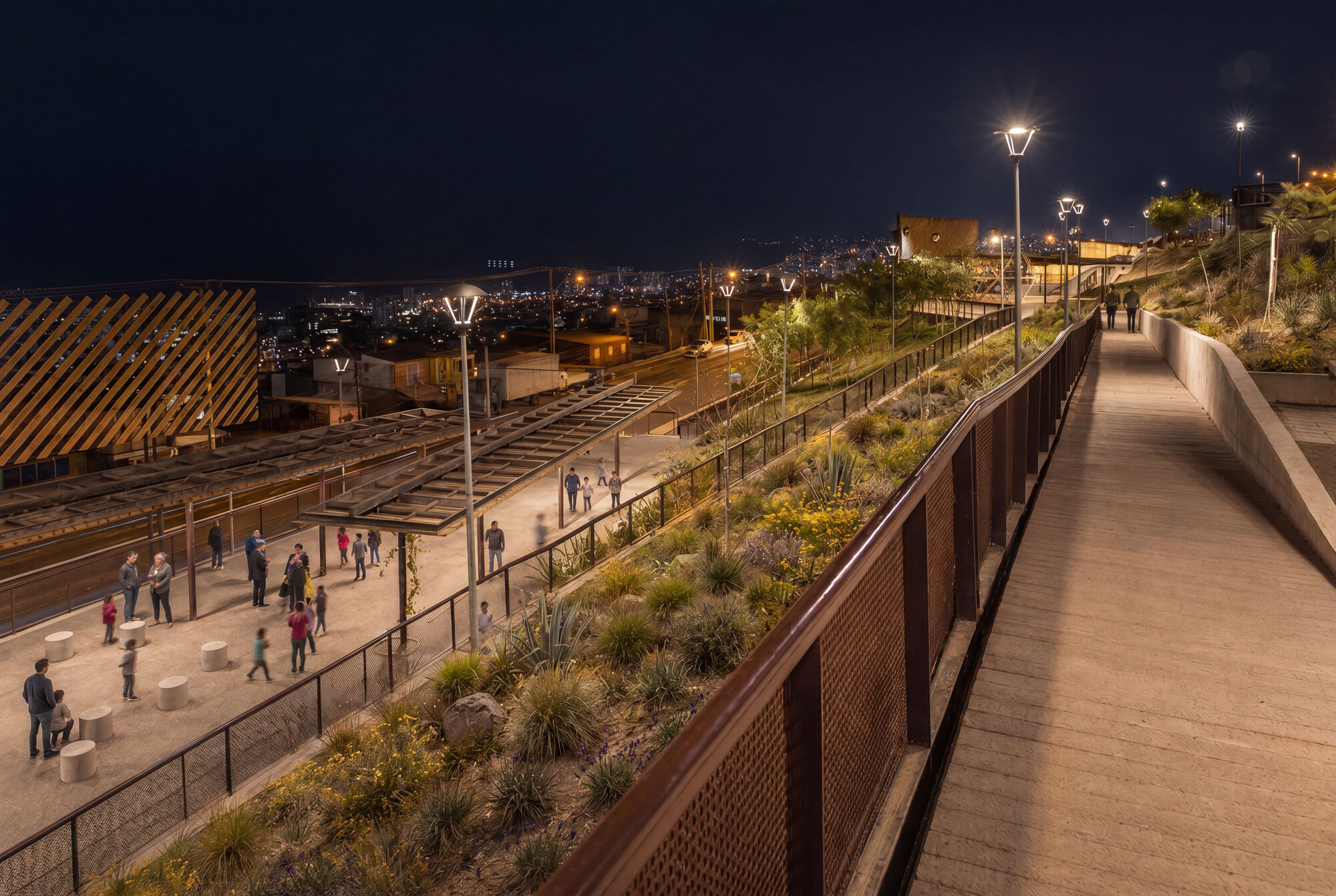 Night view of a planted slope between a rust-toned mesh railing, a boardwalk ramp and a plaza where families gather under street lamps