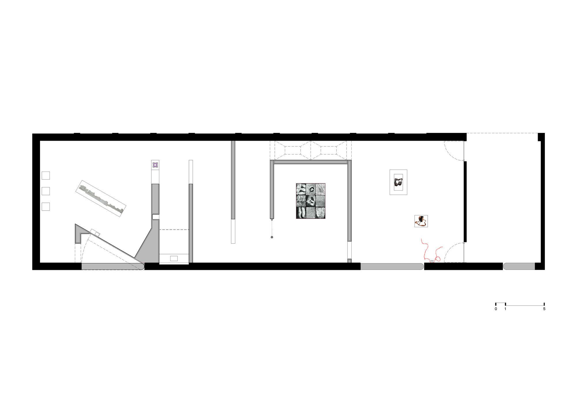 Floor plan drawing of a long rectangular gallery showing angled partitions, a central square of framed images and a red line near the entrance