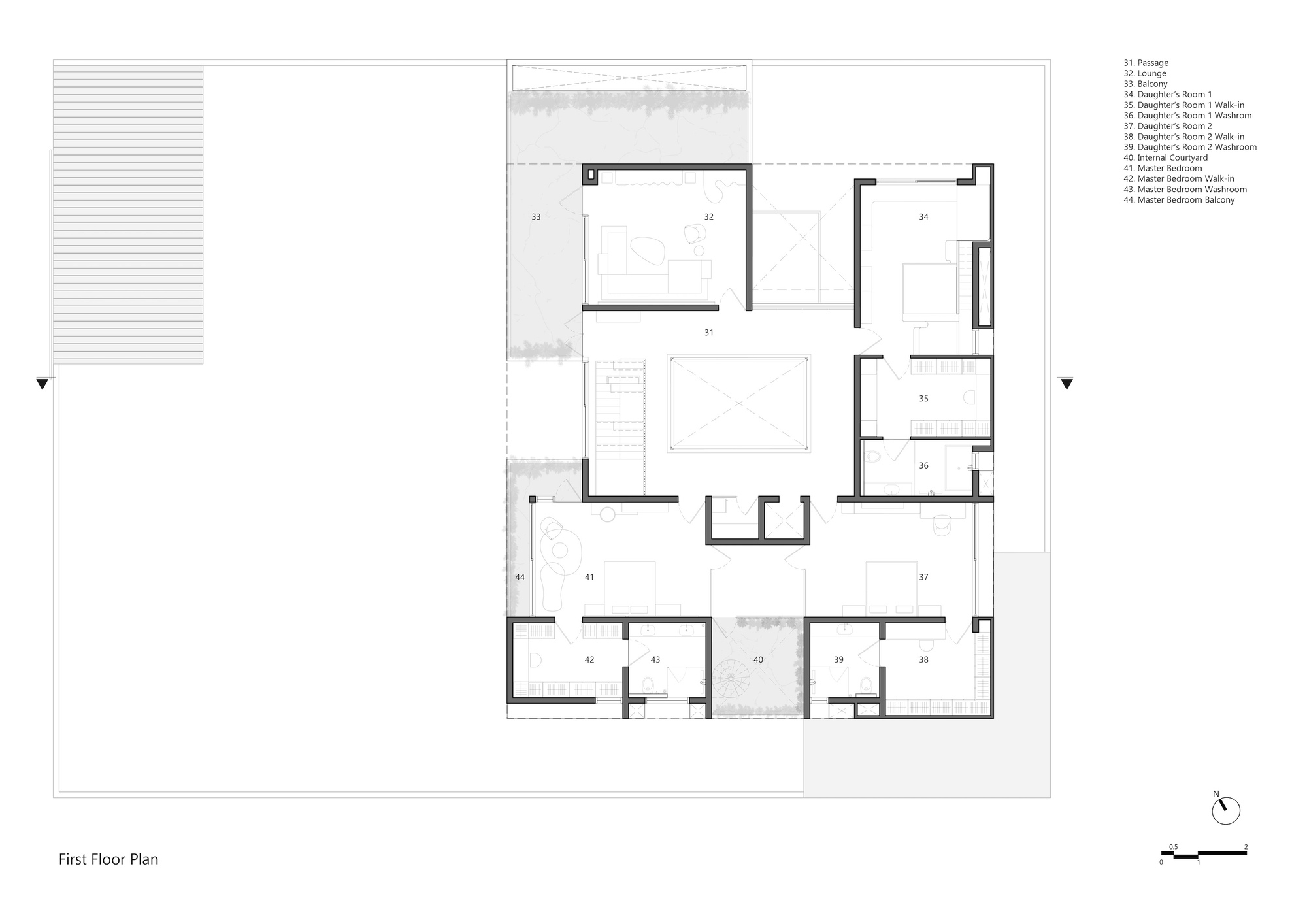First floor plan drawing showing bedrooms, a lounge and walk-in closets arranged around an internal courtyard and central stair