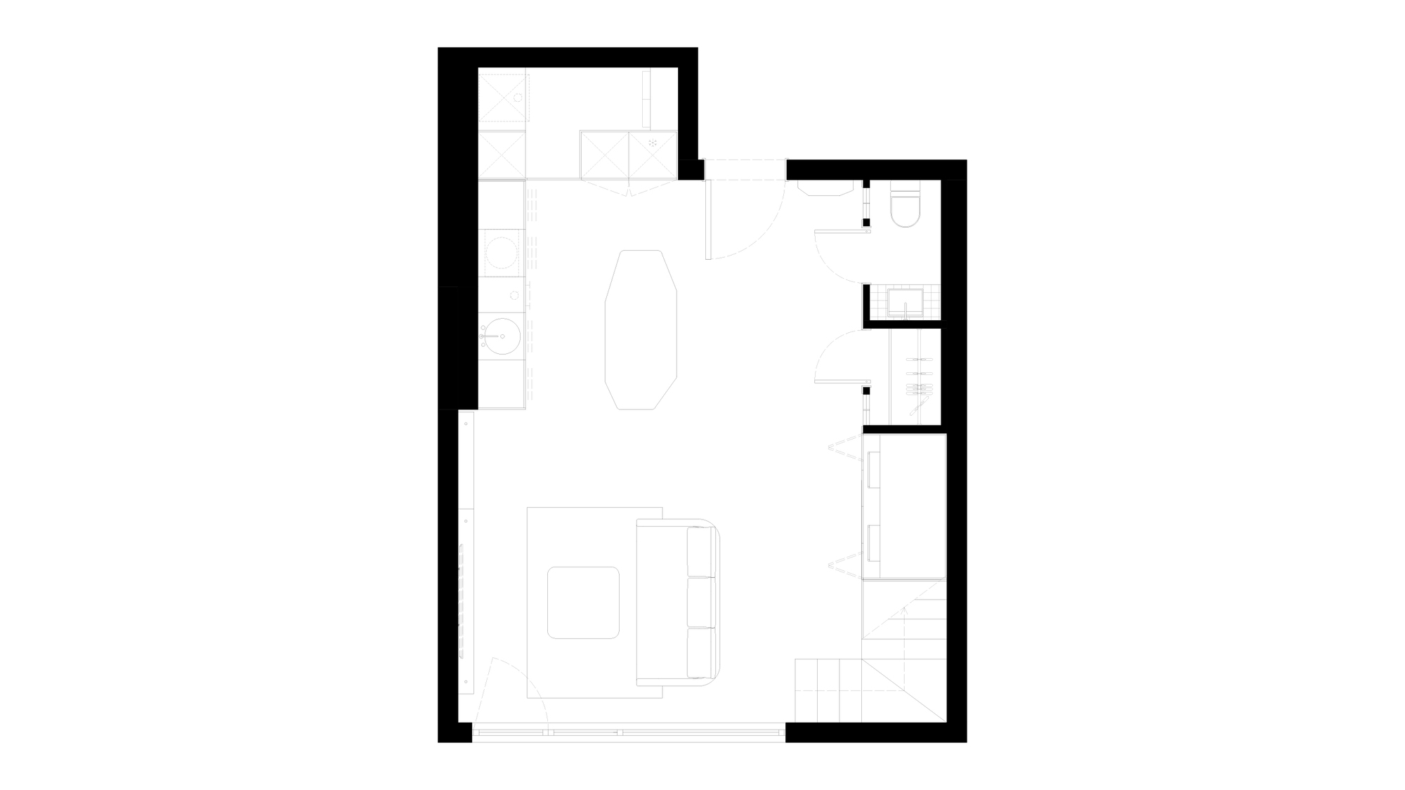 Ground floor plan drawing showing a kitchen along one wall, a central island, a sofa area, a small toilet and a staircase