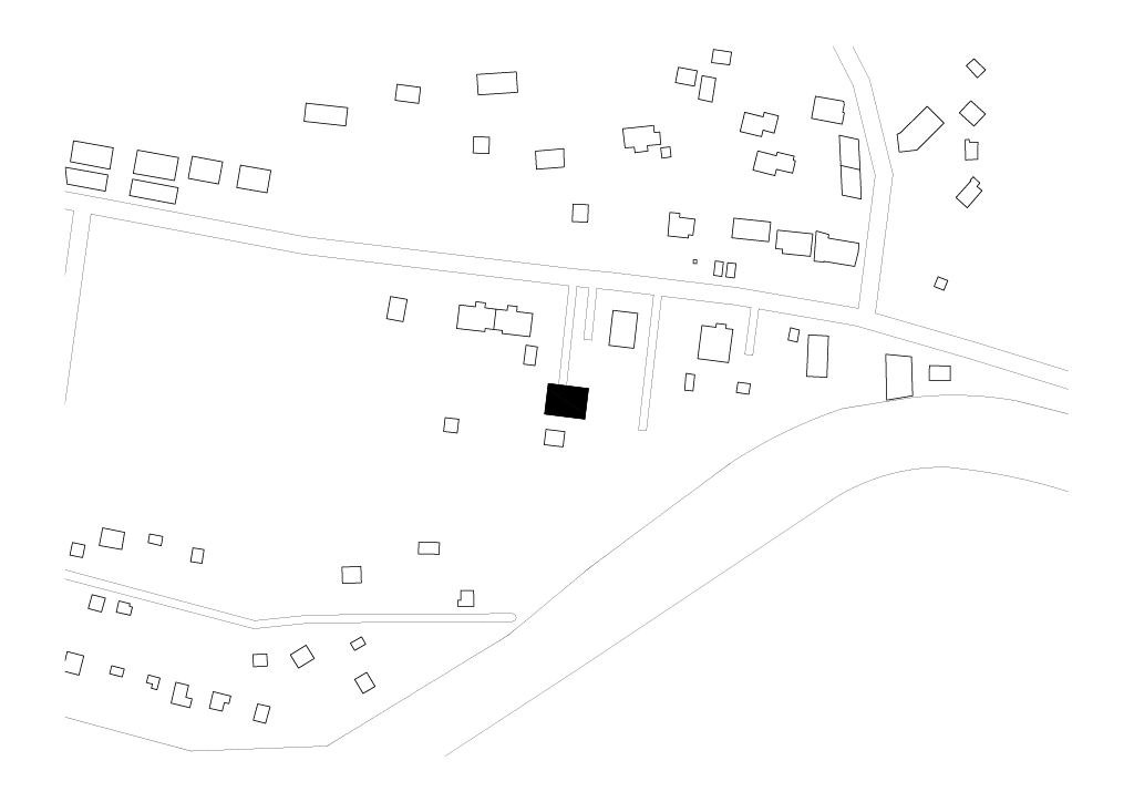 Site plan drawing with one solid black square building set beside a lane among scattered outlined houses and curving roads