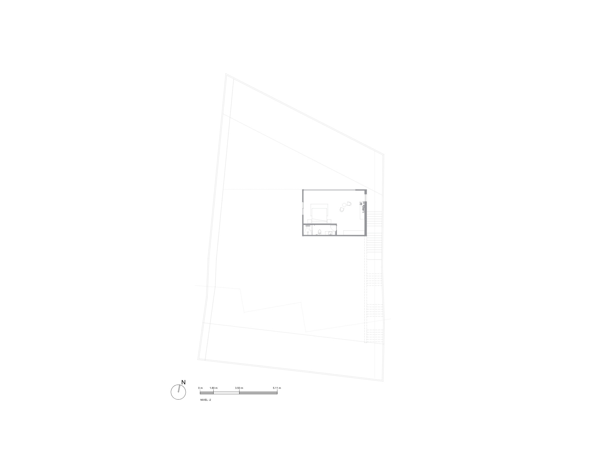 Floor plan drawing of the top level showing a single small room set within a large irregular site outline