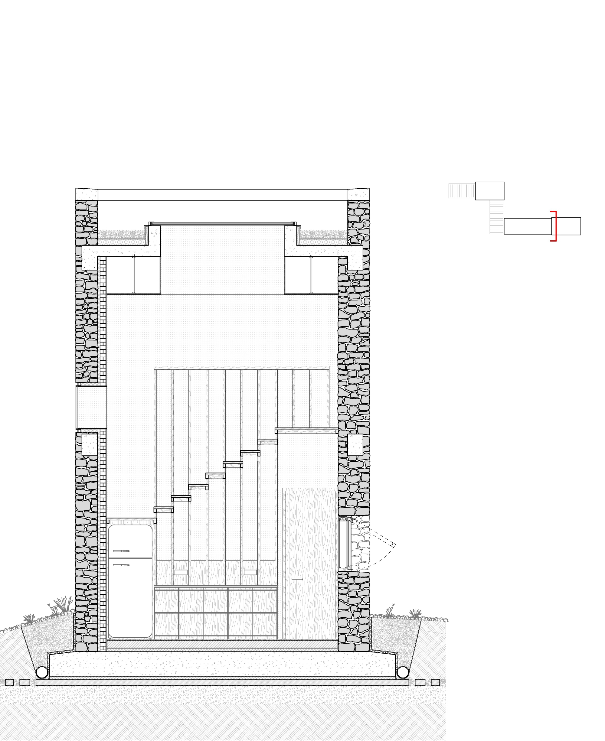 Section drawing of a tall stone-walled volume showing a stepped staircase, built-in storage, a green roof edge and drainage pipes at the base