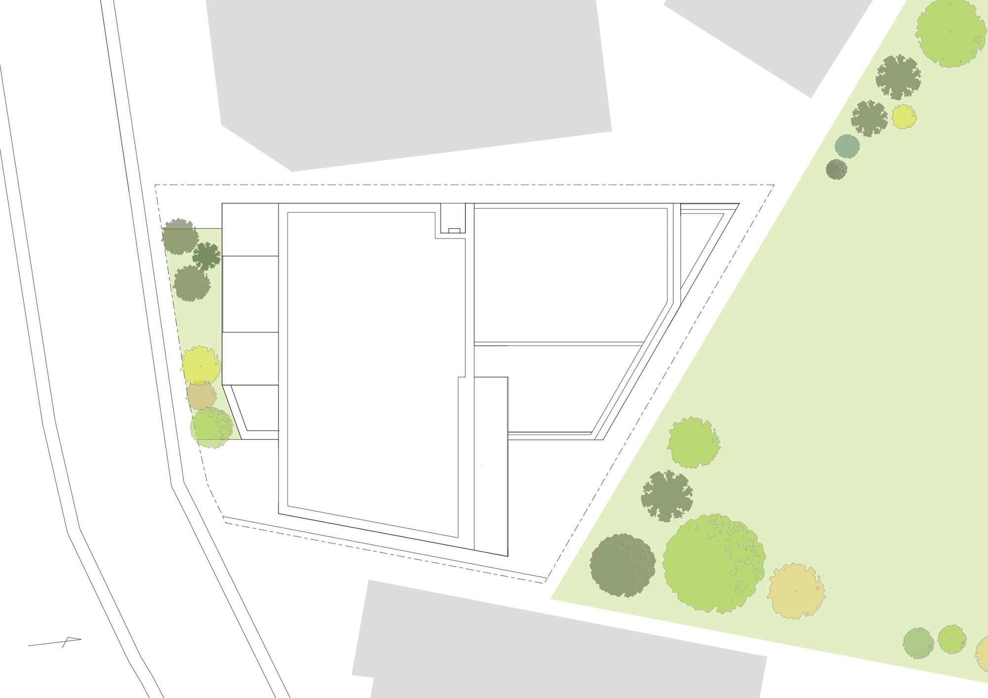 Site plan drawing of an irregular polygon footprint beside a road, with green park trees along the east edge