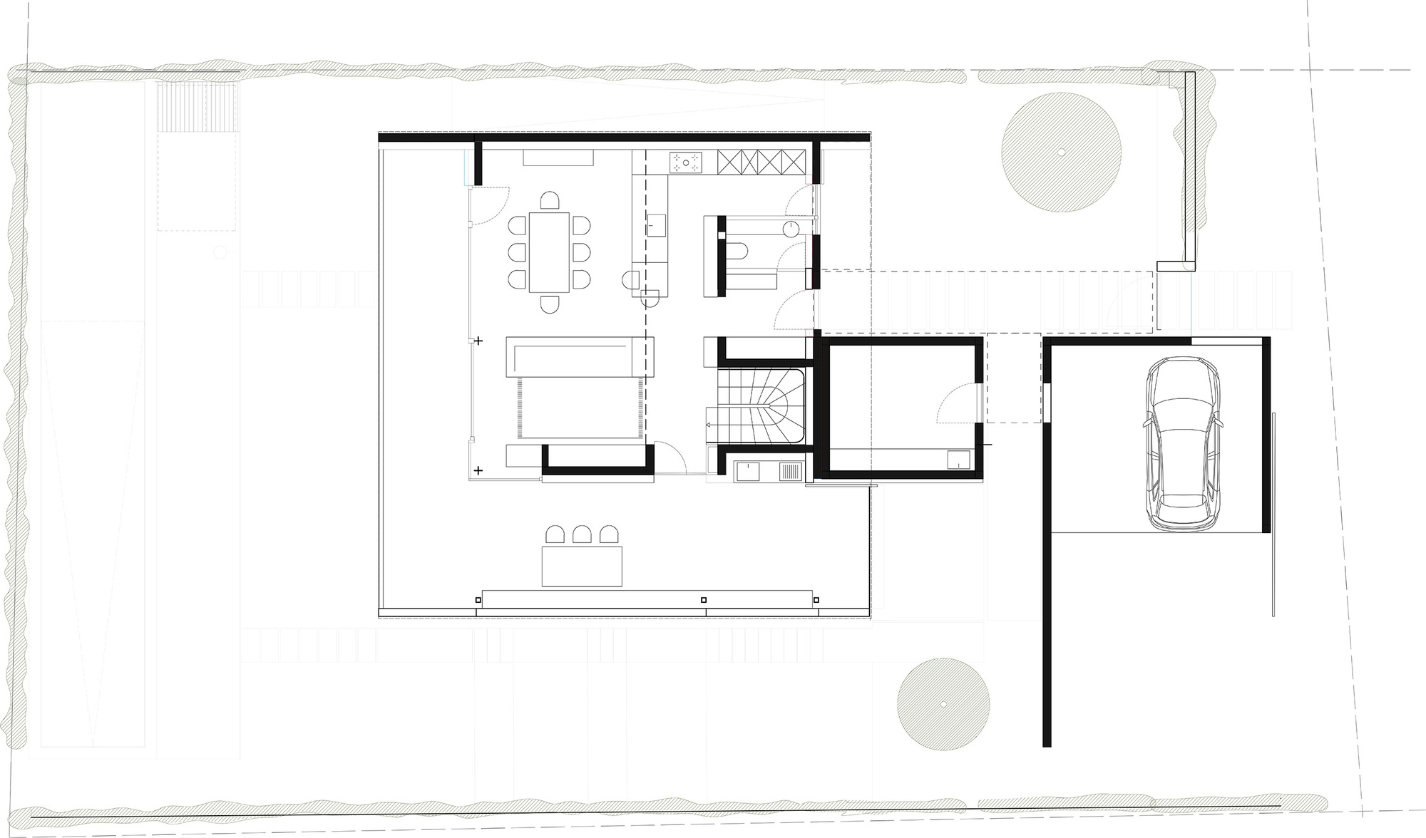 Ground floor plan drawing showing the open living and dining area, kitchen, stair, utility room and a carport with a parked car