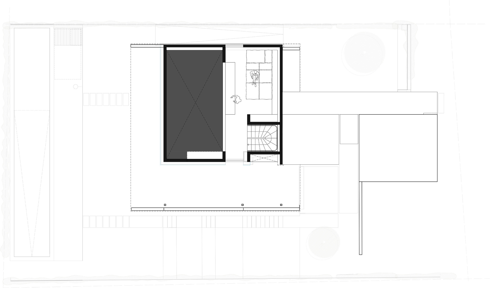 Plan drawing of an upper level showing a dark rectangular volume, a stair core and a furnished room beside a long terrace