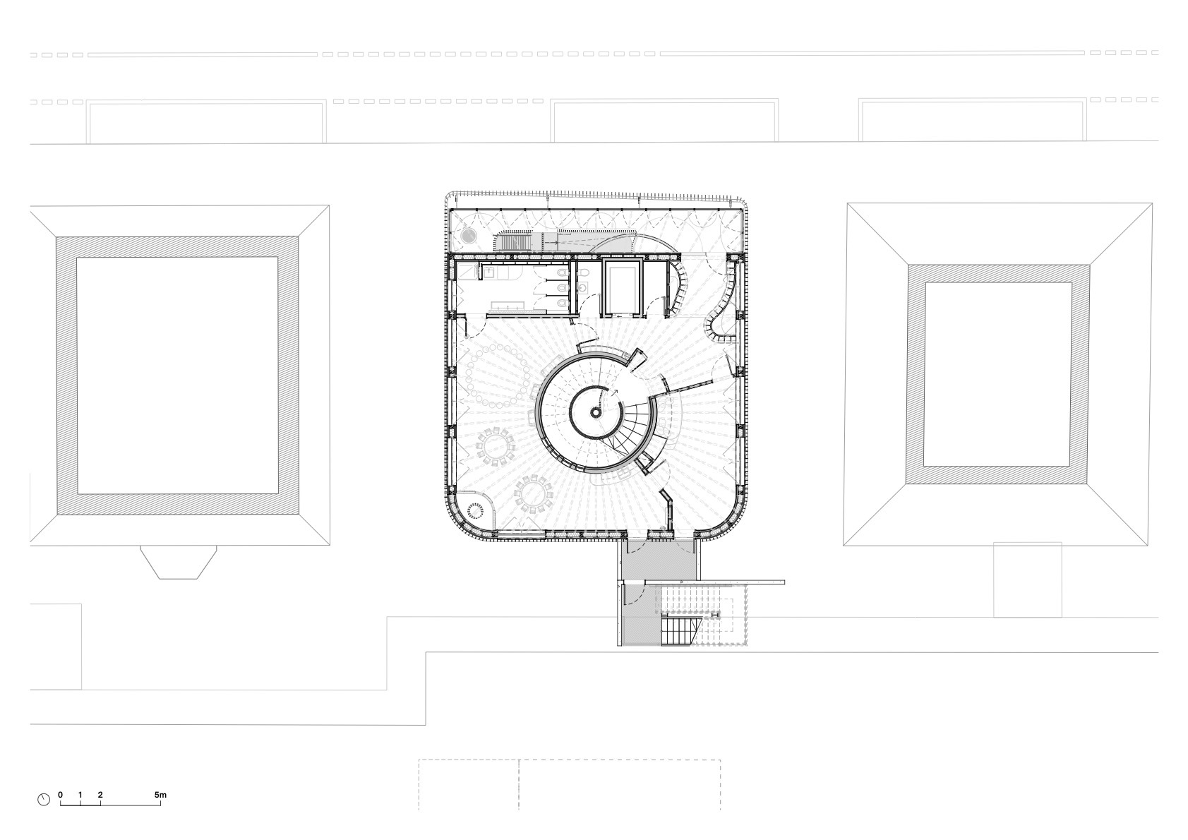 Upper floor plan drawing showing a circular spiral stair at the center of a rounded square room between two hipped roofs