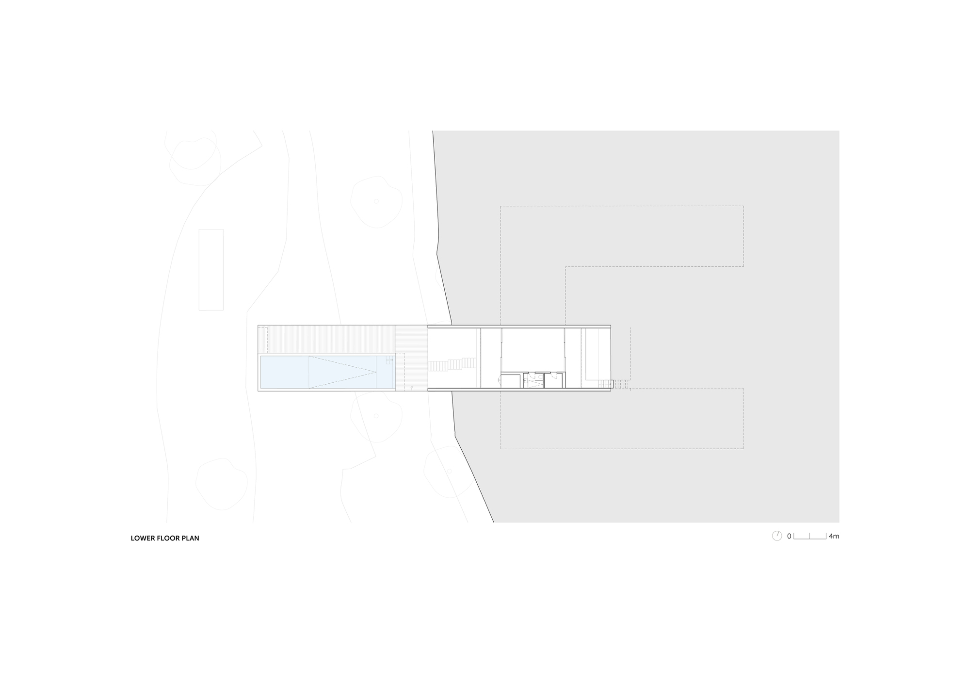 Lower floor plan drawing showing a narrow bar with a pool at one end, set against a shaded slope
