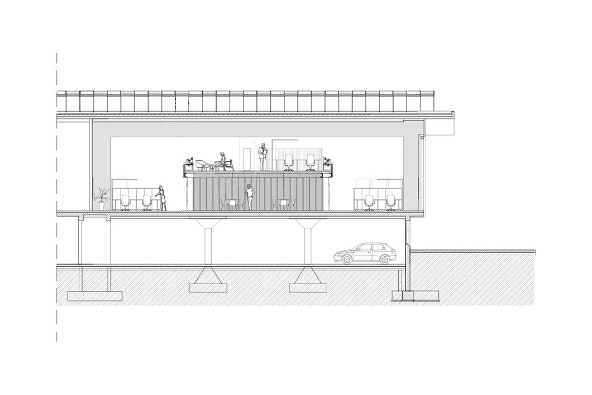 Cross section drawing of an office floor with a central mezzanine box, concrete piers and a car parked beneath