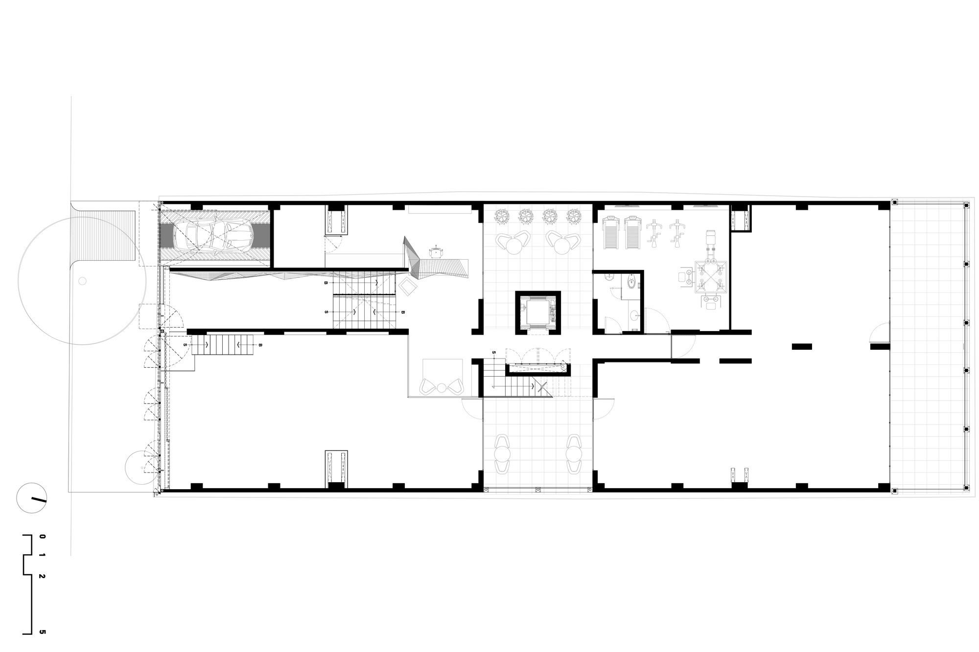 Ground floor plan drawing showing a central lift core, entry lobbies, parking bays and a gridded terrace at the right end