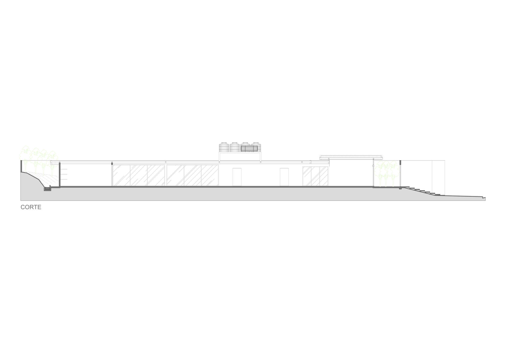 Section drawing cutting through a long single-storey volume with glazed panels, doors, rooftop water tanks and a stepped ground slope at the right end