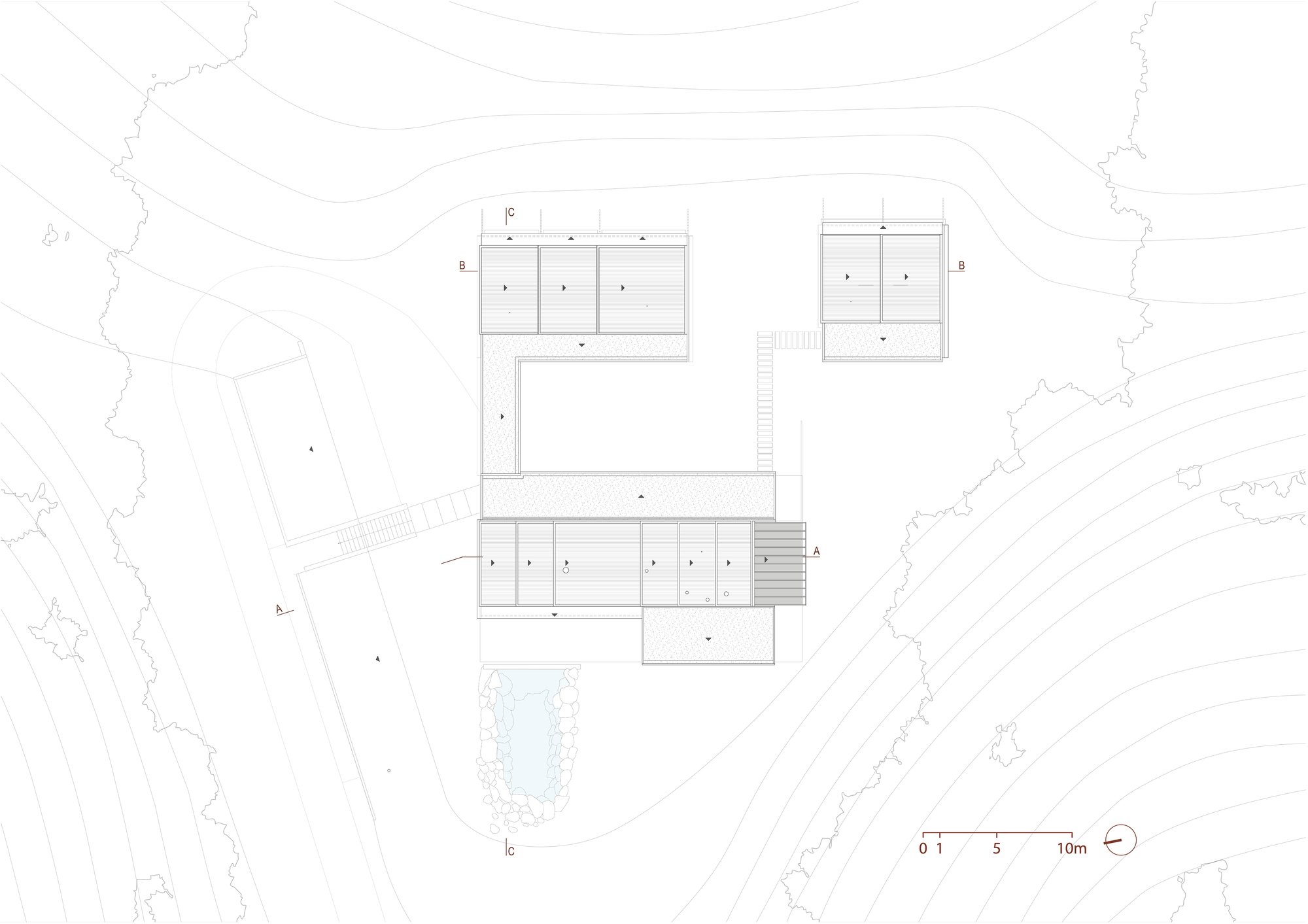 Roof plan drawing showing sloped roof planes over the main pavilion and two bedroom wings, with a deck stair and pond on the contour site