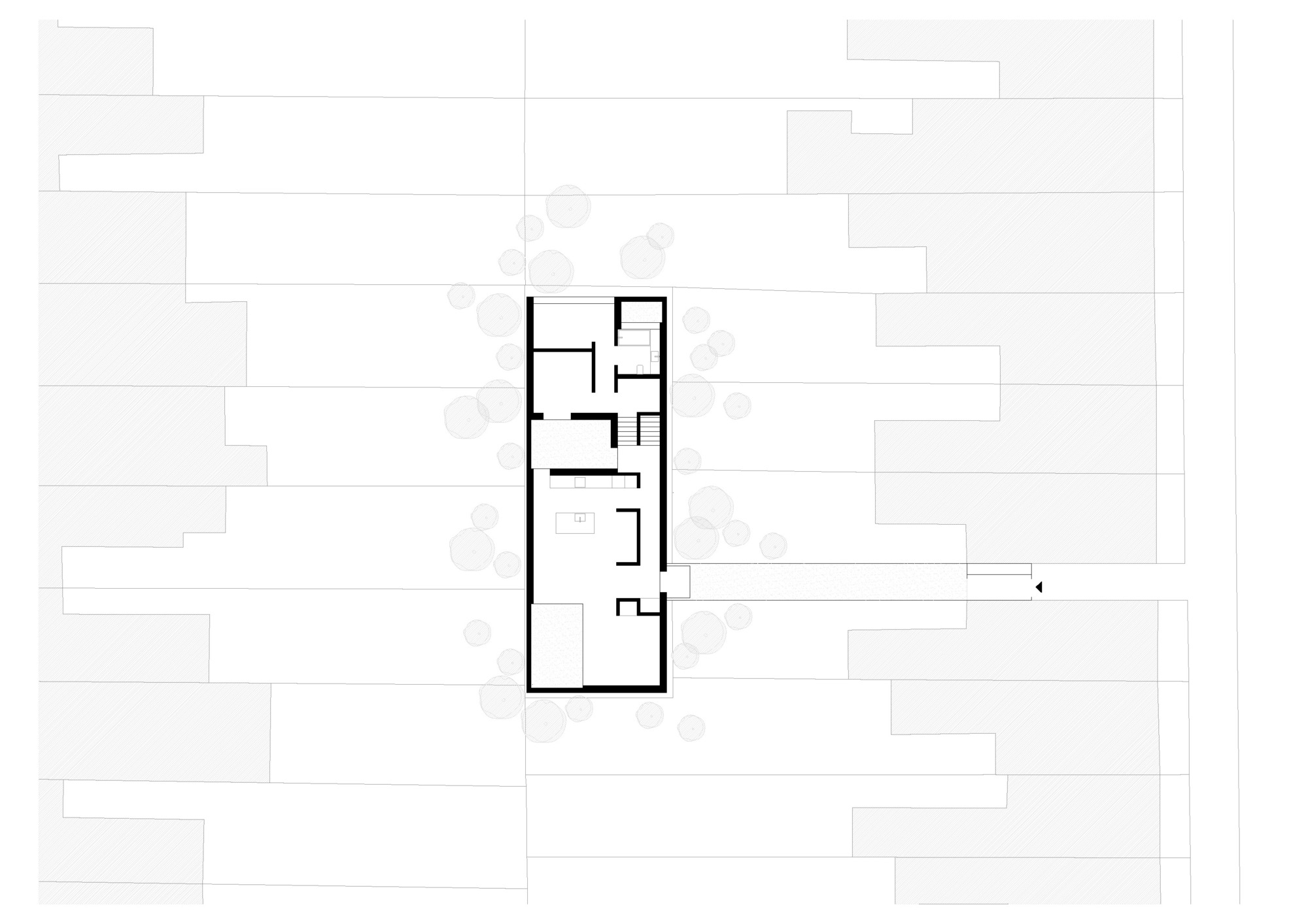Ground floor plan drawing showing a narrow rectangular house with kitchen, rooms and stair, linked by a long path to the street
