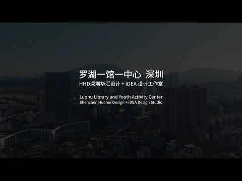 Title card over a darkened aerial view of a dense hillside district under overcast dusk light