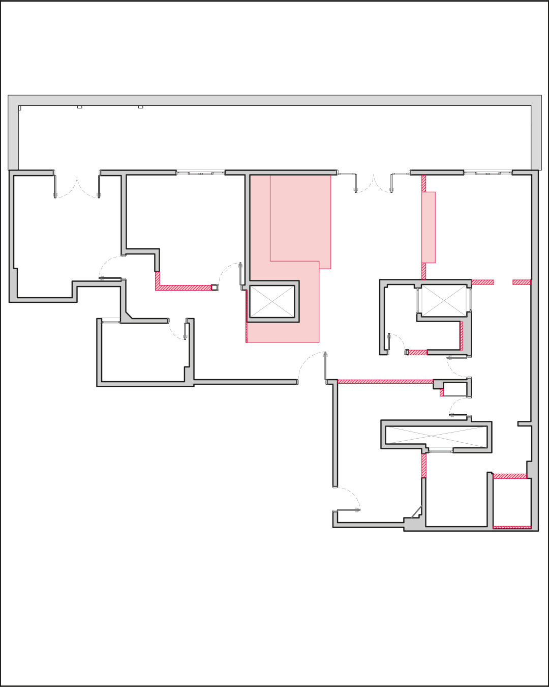 Demolition plan drawing of an apartment layout, with walls to be removed and shaded zones highlighted in red