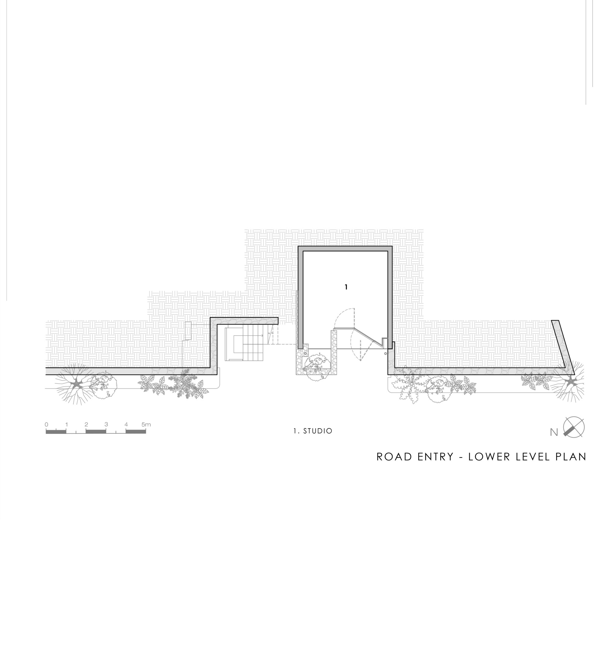 Lower level plan drawing of a road entry showing a single studio room, a stair and a paved forecourt behind a boundary wall