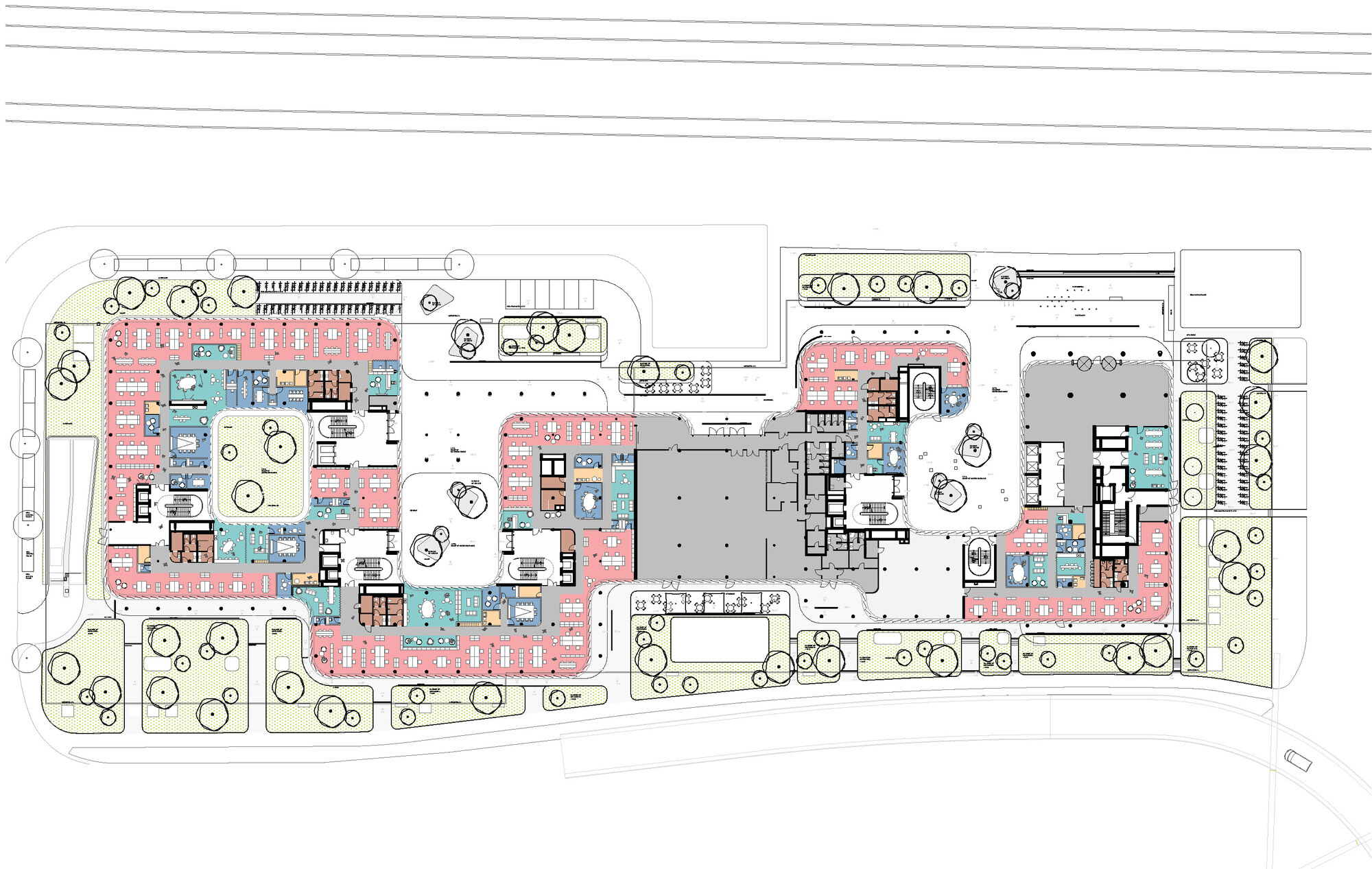 Ground floor plan drawing in colour showing office zones, cores and courtyards around two linked building volumes with landscaped edges