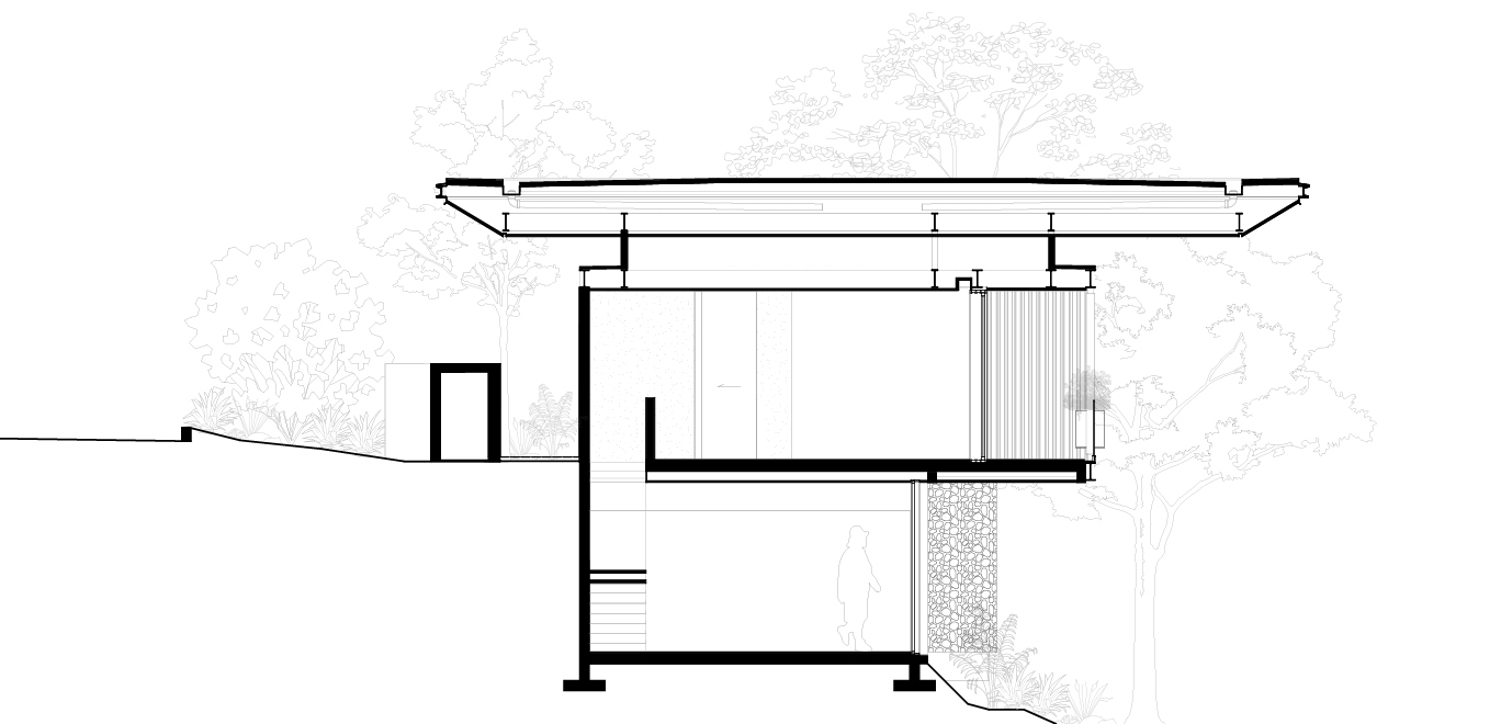 Cross-section drawing of a two-level house under a wide floating roof, with a stone retaining wall and trees drawn behind