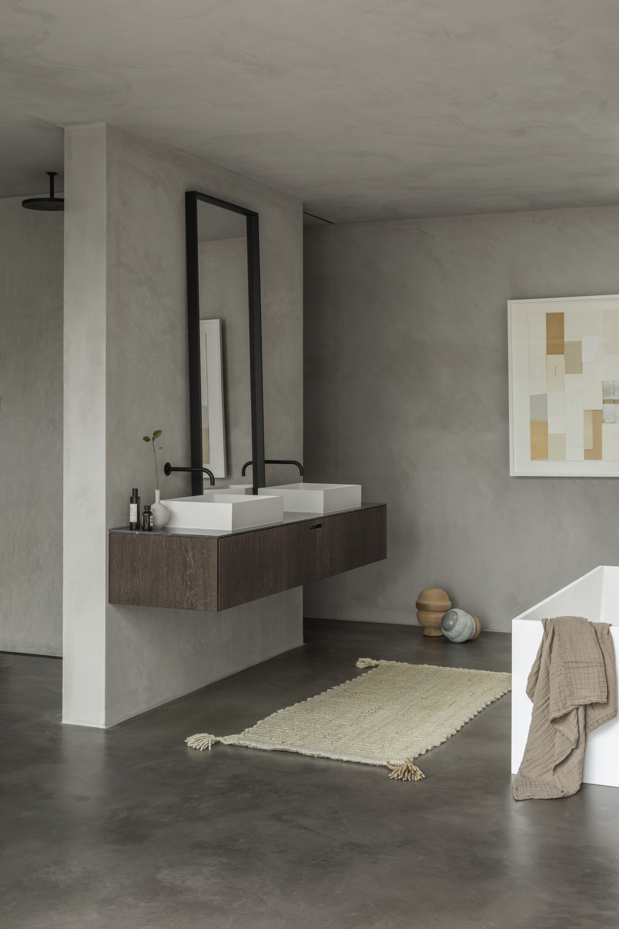 Bathroom with floating dark timber vanity and rectangular vessel sinks beneath a tall black-framed mirror