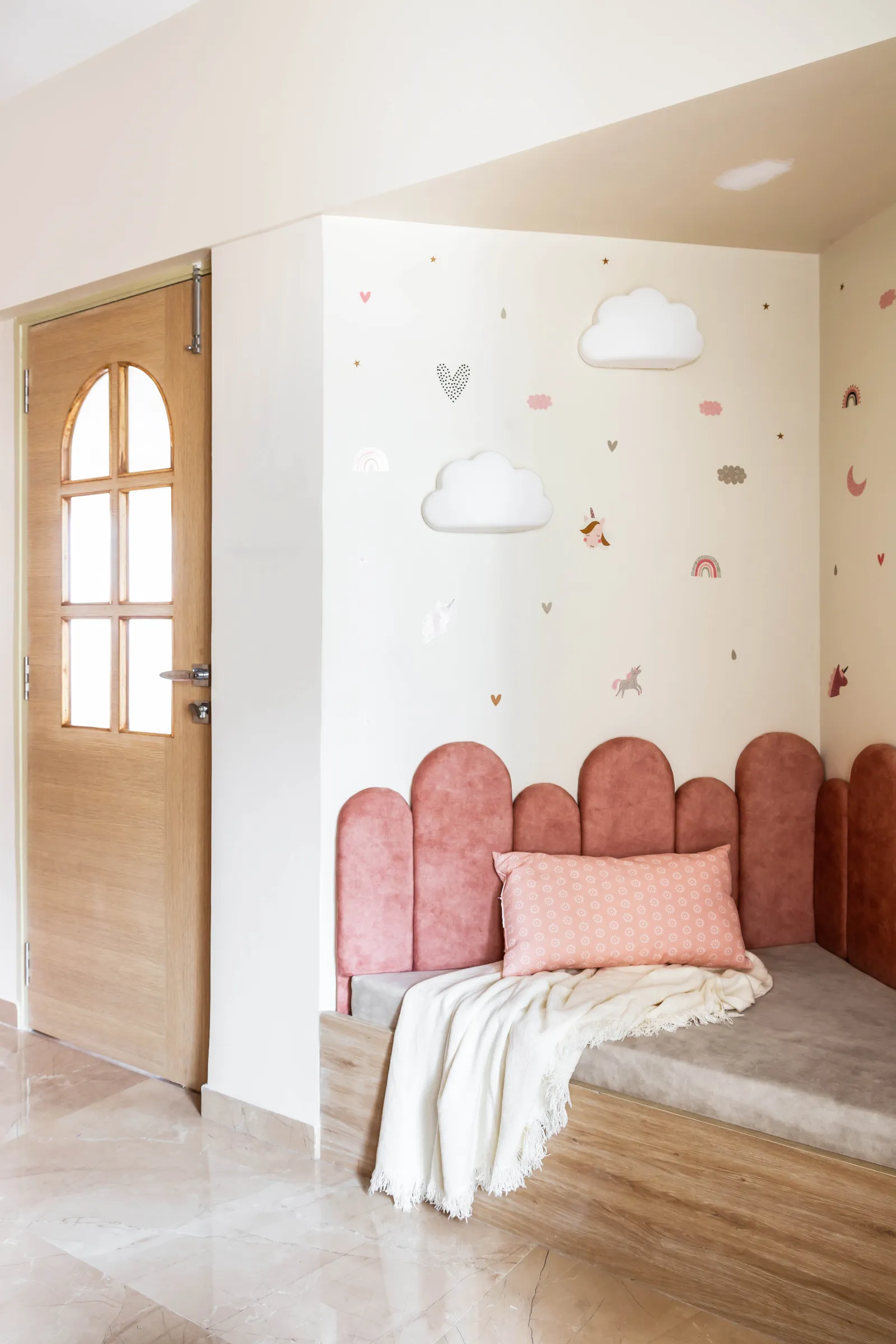 A pastel peachy pink teamed with birch wood adds playfulness to the kid’s room. Anuja Kambli