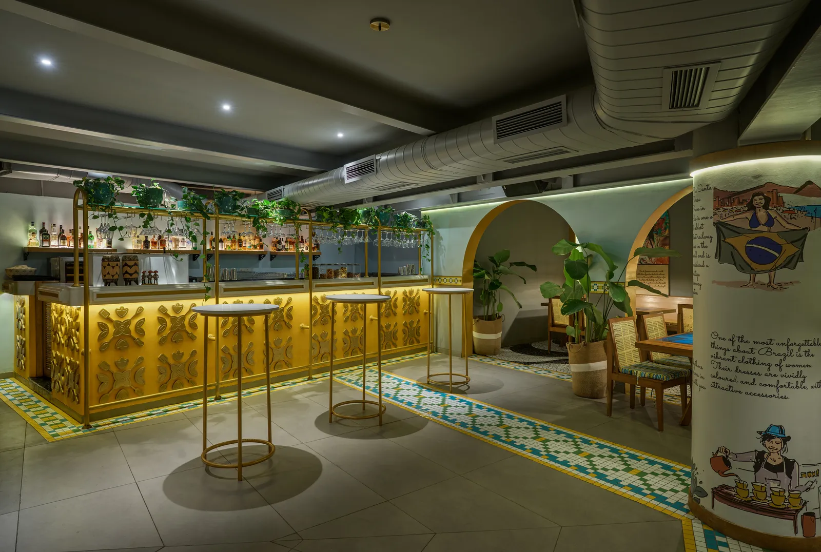 The bar is painted in yellow. The columns seen here showcase scenes from Brazil. Shamanth Patil