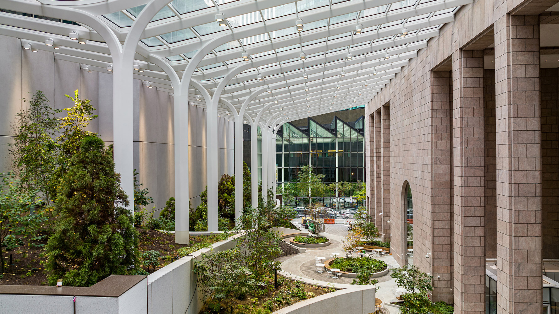 Snøhetta’s reimagining of 550 Madison's public space is a 21,000 square foot garden-atrium-galleria sheltered by a glass canopy. Photo © Barrett Doherty