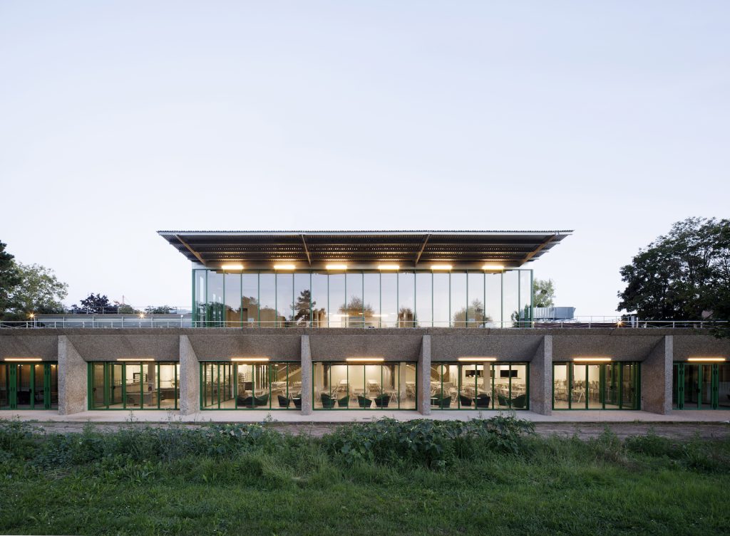 We are focusing our interest on the production rather than the sum of the building,’ says Carlo Grispello, co-founder of Graal Architecture. In their 2021 university cafeteria in Cergy‑Pontoise, this means retaining the integrity of an existing building and adding to it with an economy of means
