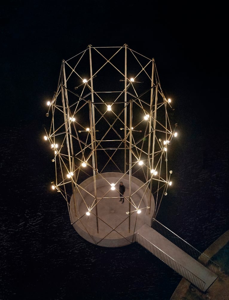 A night view of the Belvédère, featuring 32 luminous orbs that transform the pavilion into a lighthouse. Photography by © Yann Peucat.